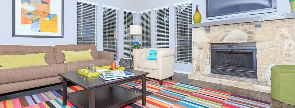Vibrant Living Room with Fireplace at Salado Crossing Apartments