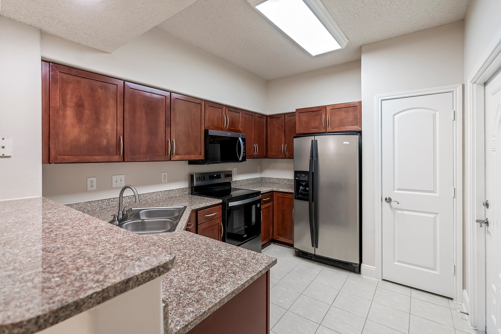 Fully Equipped Kitchen with Wood Cabinetry