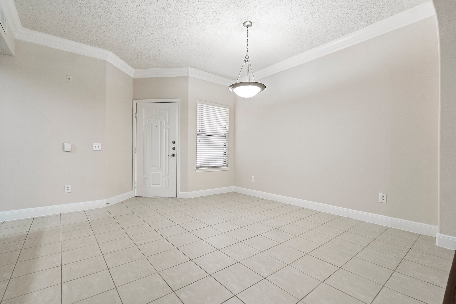 Bright Entryway with Tile Flooring and Lighting