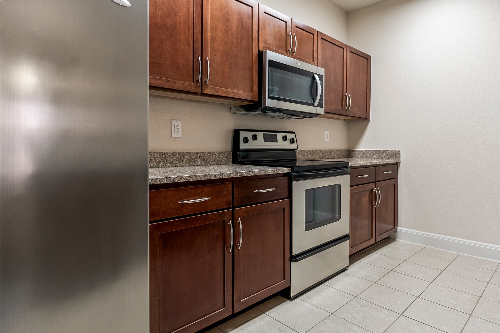 Fully Equipped Kitchen with Wood Cabinetry