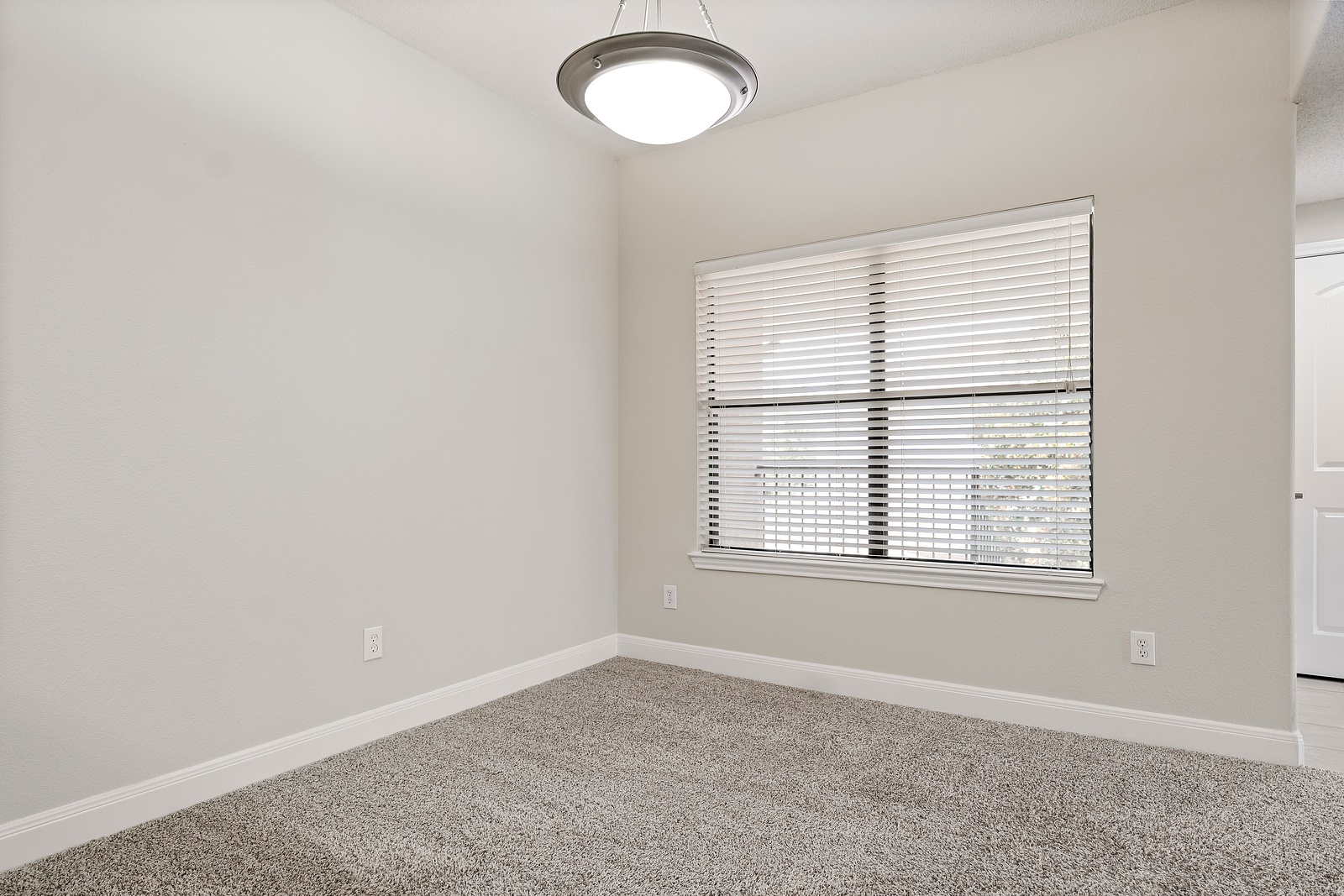 Spacious Bedroom with Pendant Lighting