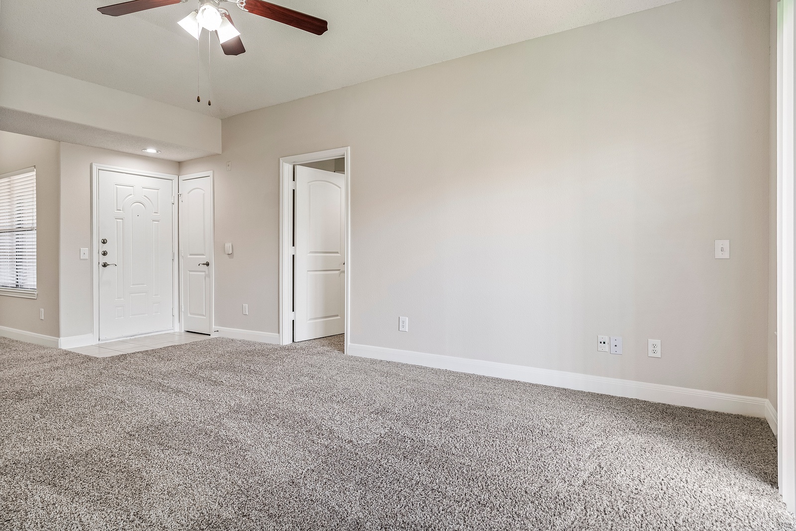 Spacious Living Room with Plush Carpeting