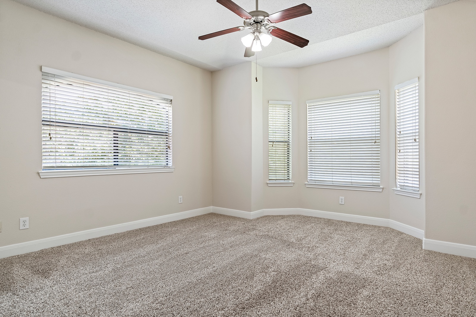 Spacious Bedroom with Bay Window Design Feature
