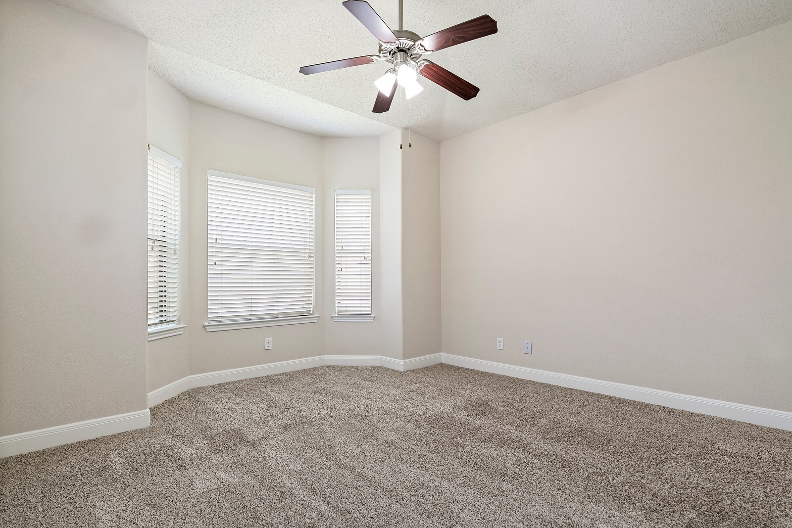 Spacious Bedroom with Bay Window Design Feature