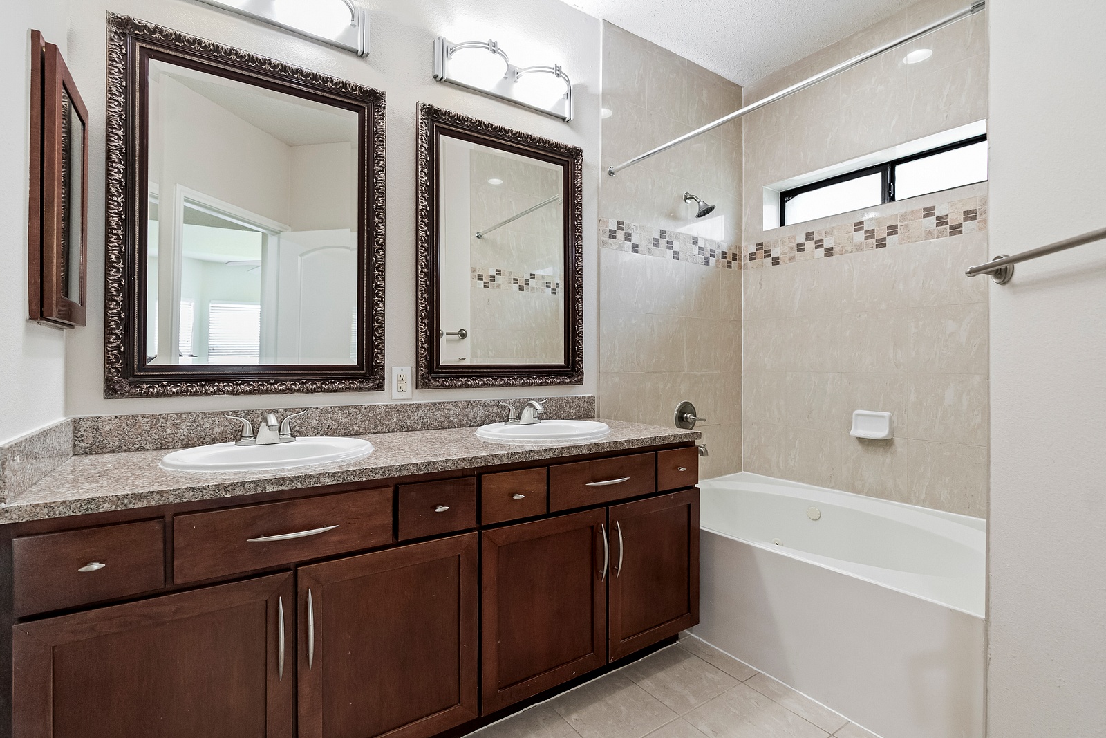 Elegant Bathroom with Dual Vanity and Tub