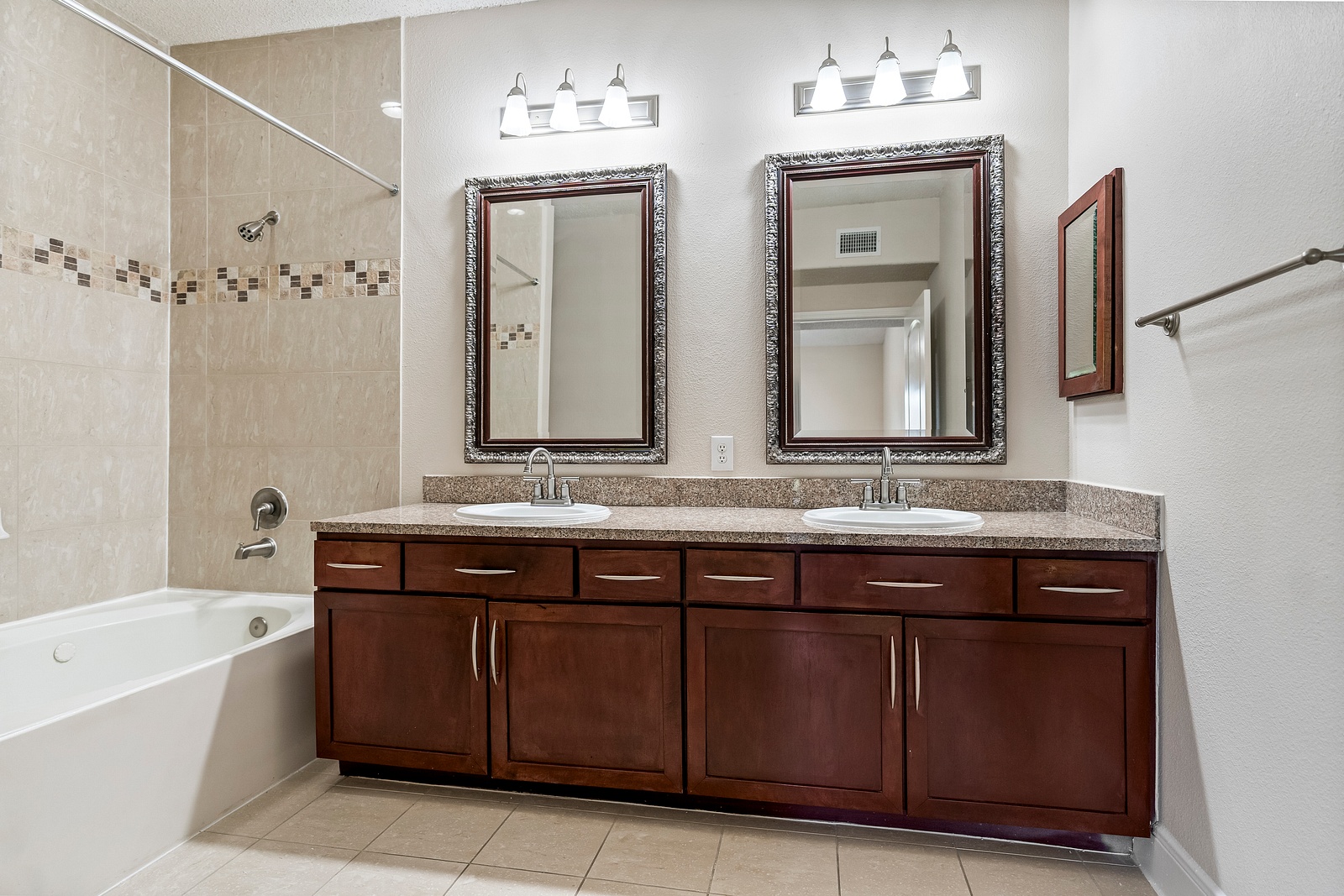 Elegant Bathroom with Dual Vanity and Tub