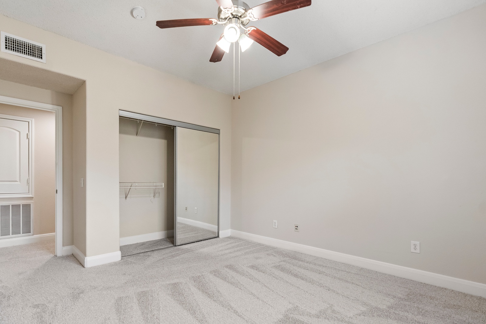 Bedroom with Mirrored Closet Doors