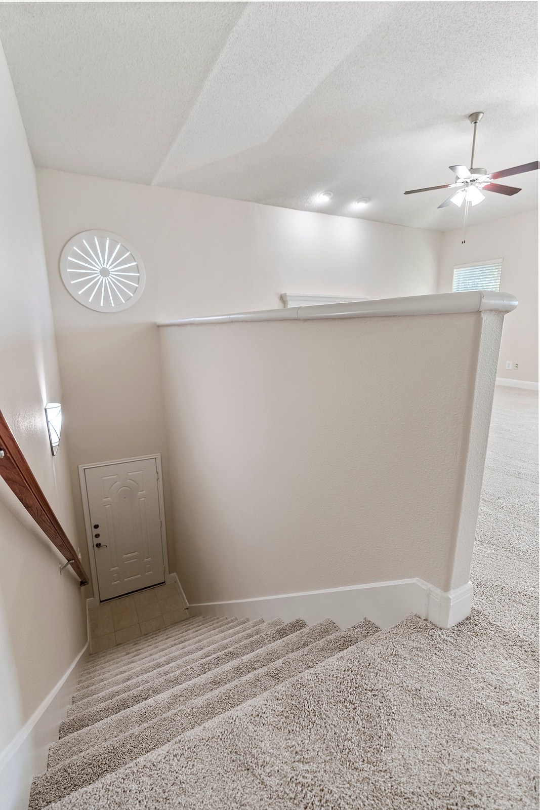 Carpeted Staircase with Decorative Accents