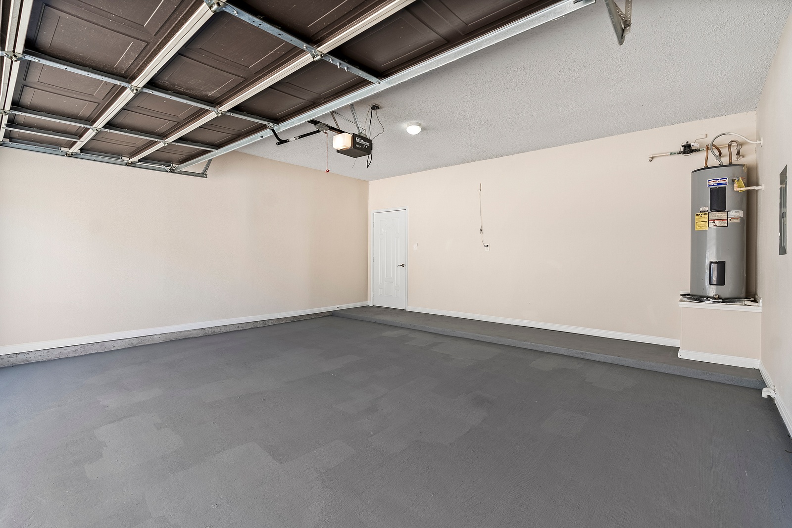 Attached Garage with Water Heater and Storage