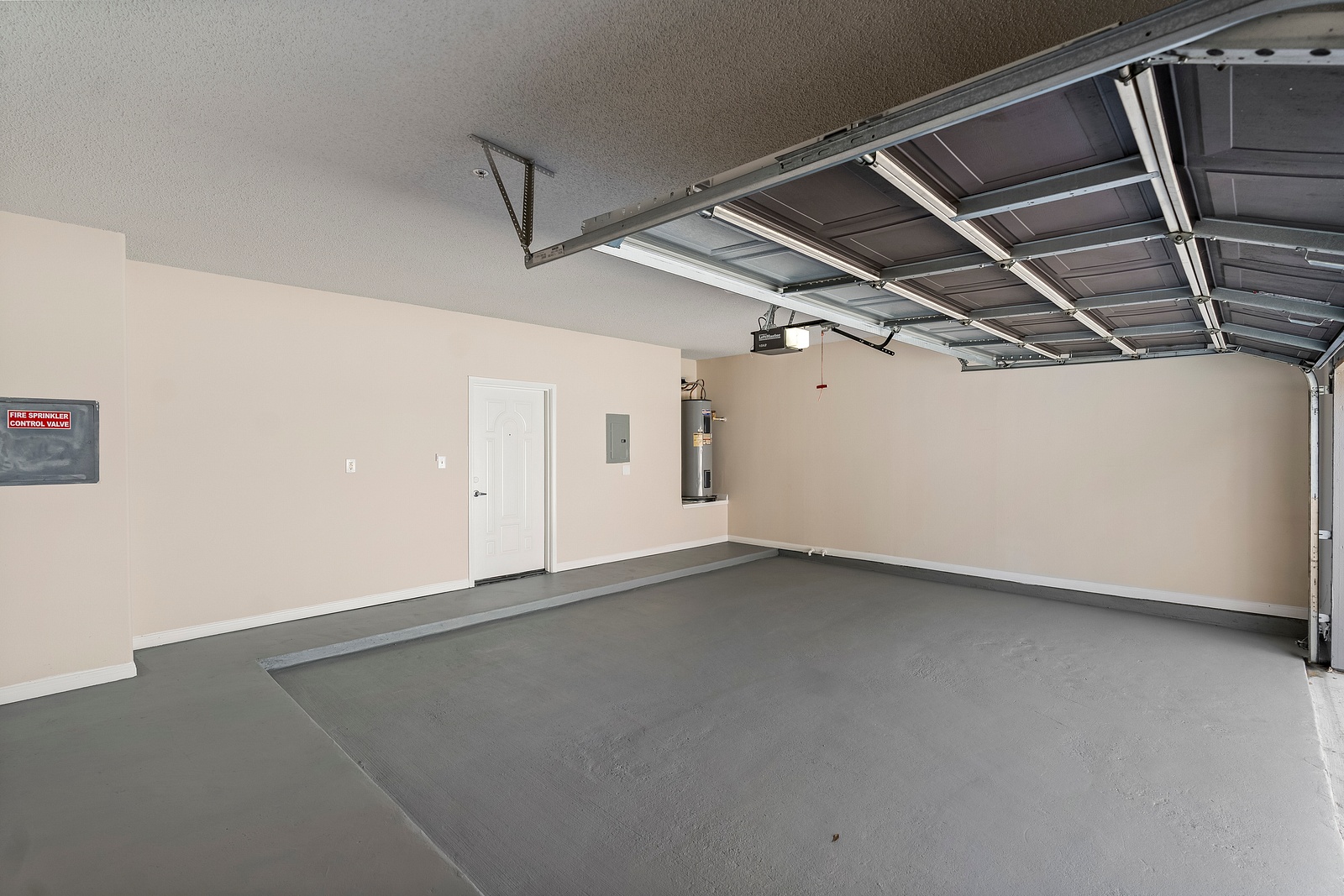 Attached Garage with Water Heater and Storage