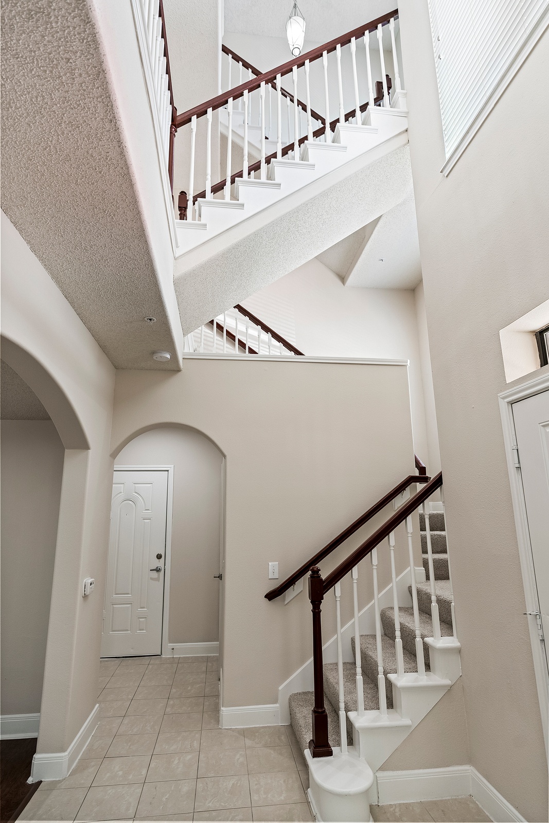 Two-Story Foyer with Elegant Staircase