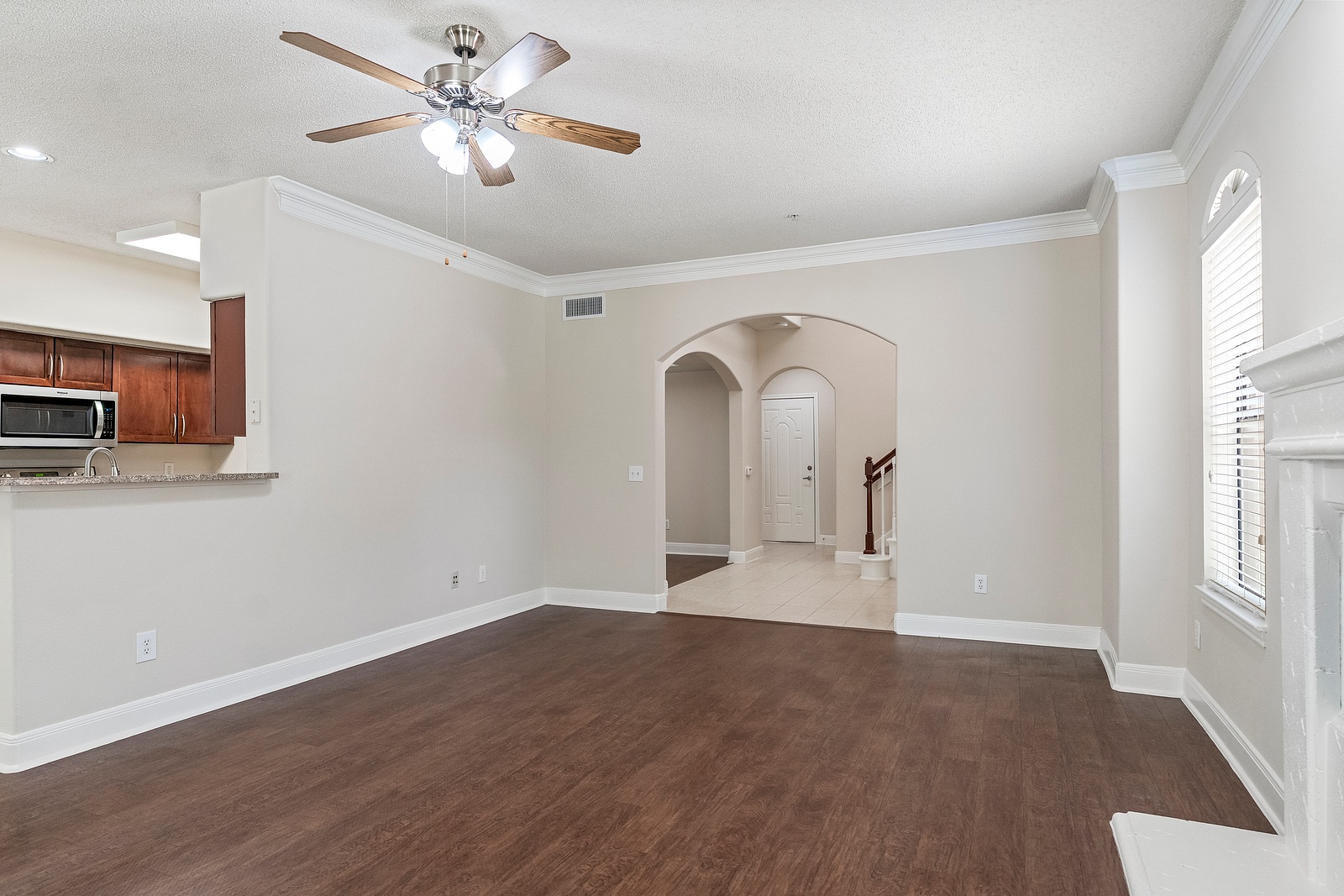 Living Room with Arched Hallway Entry