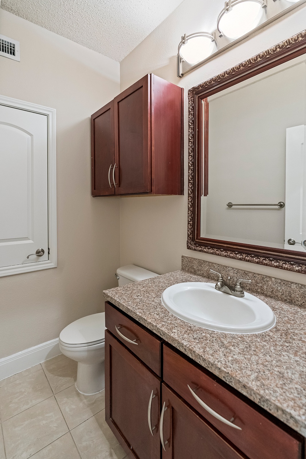 Convenient Bathroom with Granite Countertop