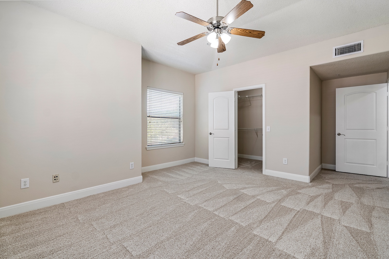Bedroom with Spacious Walk-In Closet