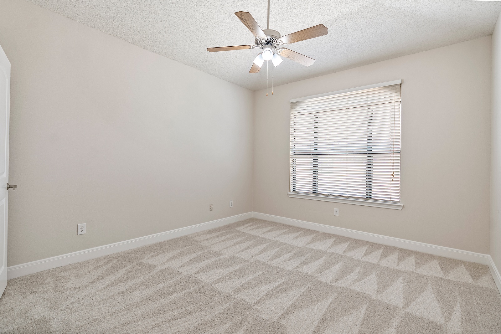 Spacious Bedroom with Plush Carpeting