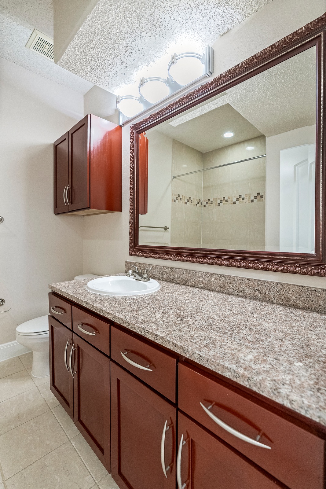 Bathroom with Granite Vanity and Mirror