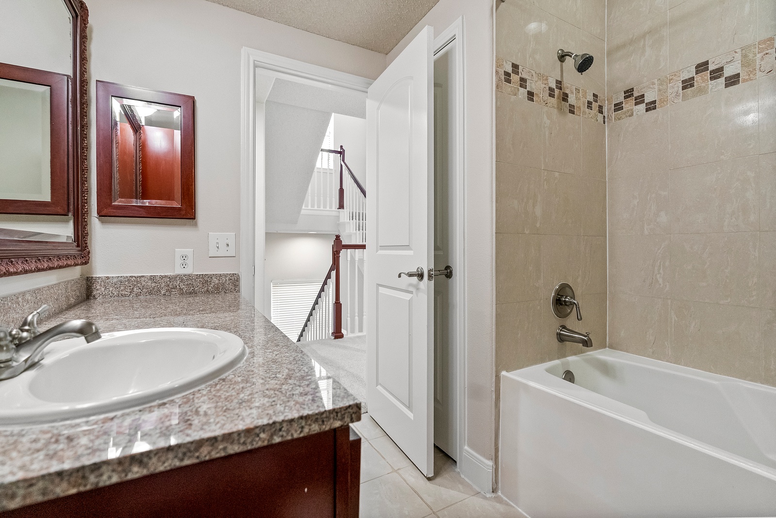 Bathroom with Tiled Tub and Shower