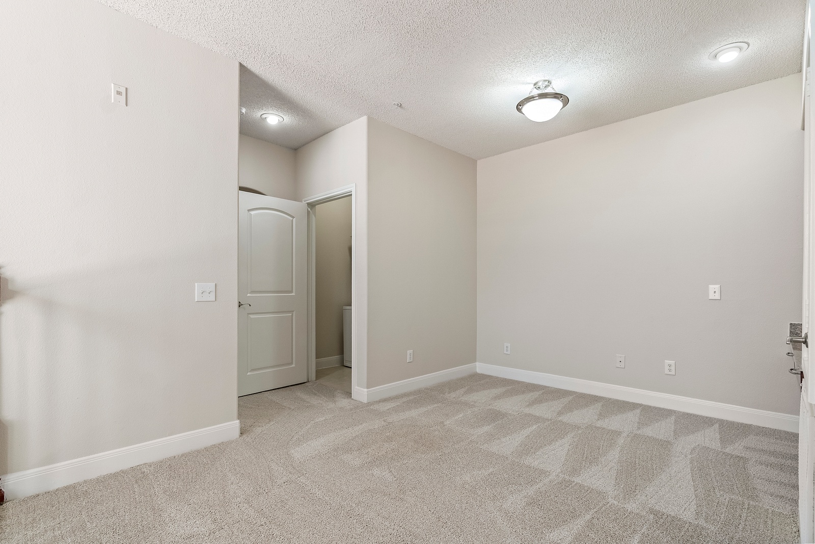 Spacious Bedroom with Plush Carpeting