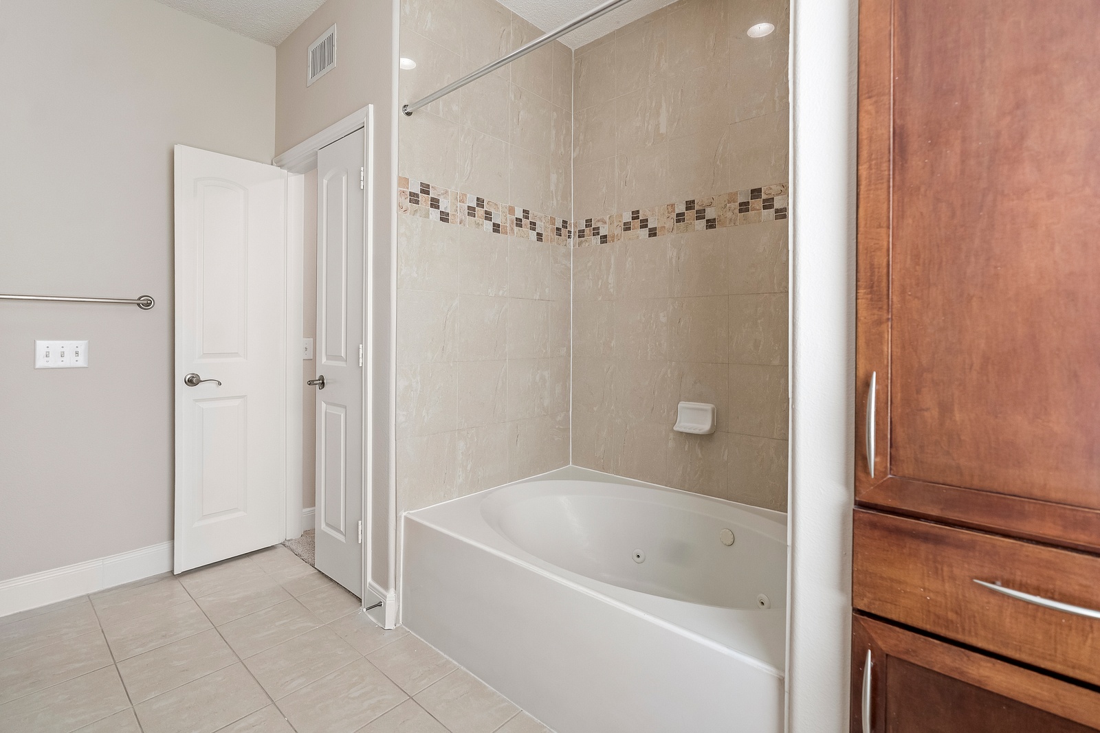 Elegant Bathroom with Soaking Tub and Tile
