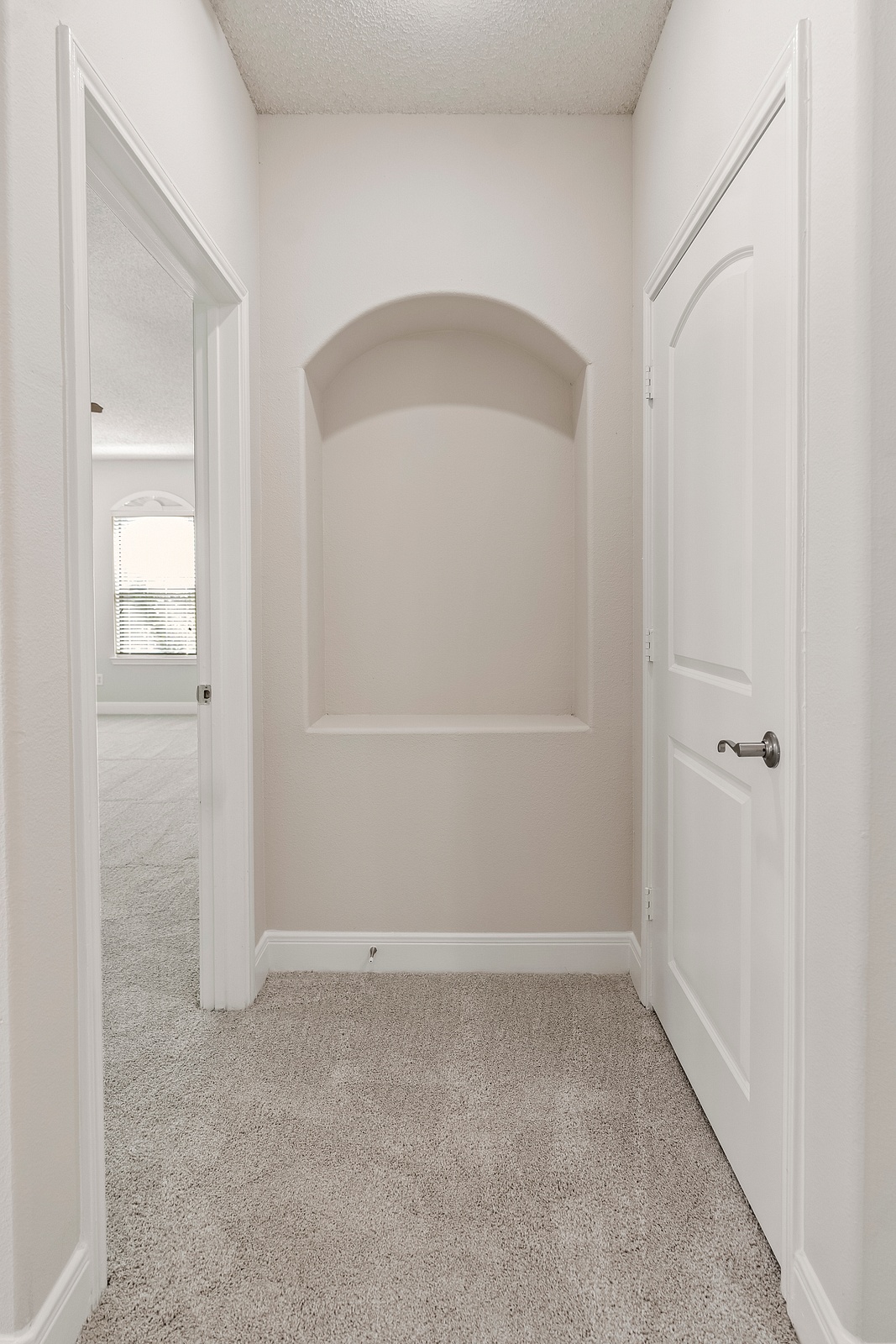 Hallway with Arched Wall Niche Feature