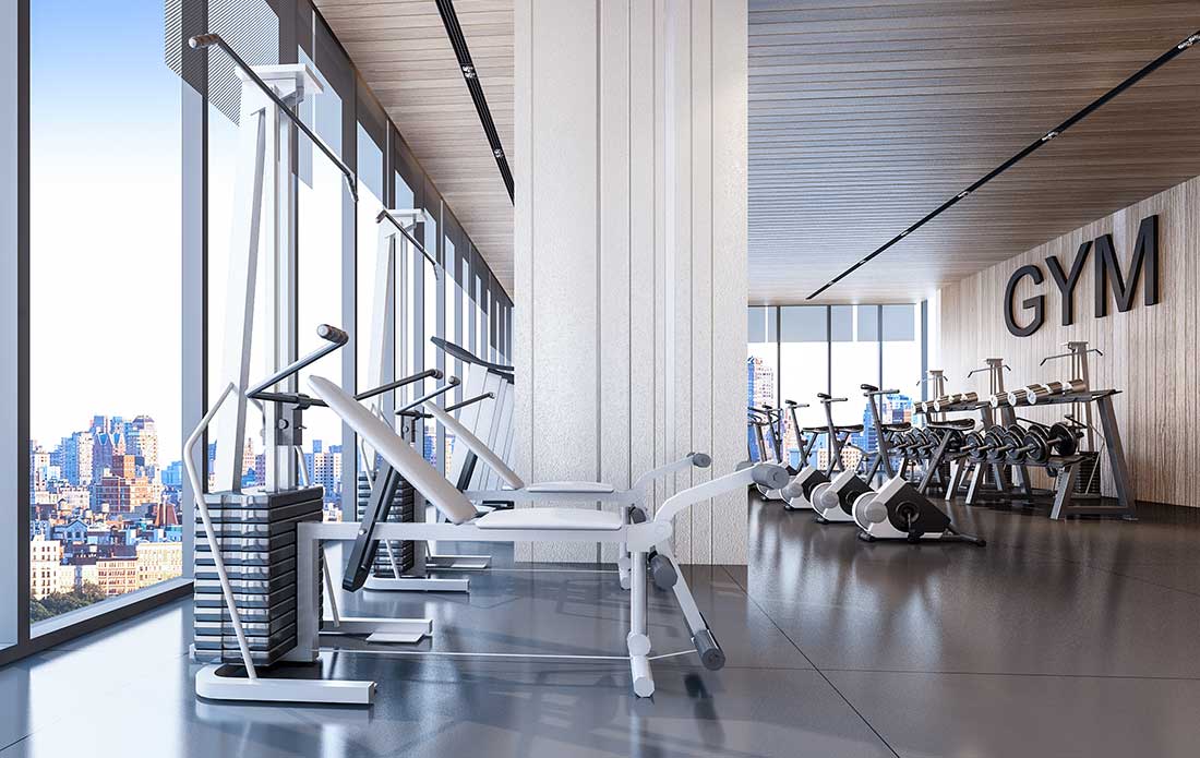 The gym featuring weight and cardio equipment