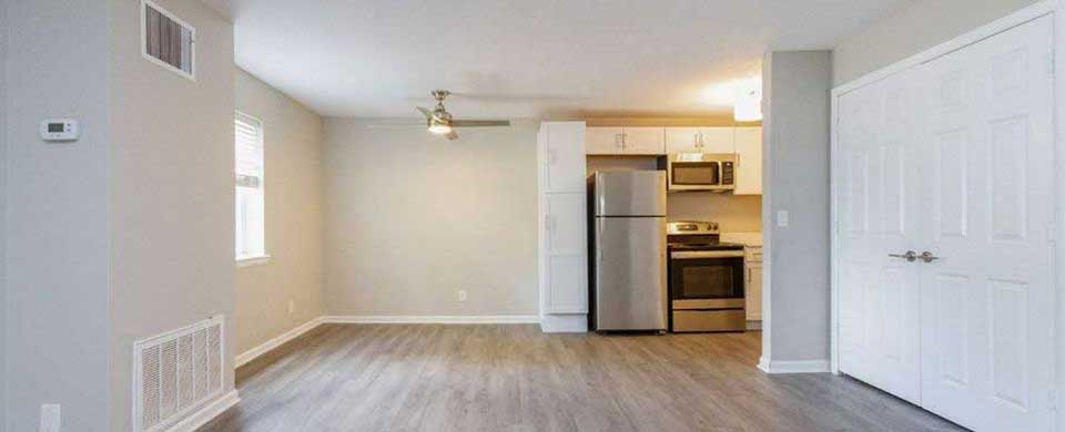 Spacious Living and Kitchen Area with Faux Wood Flooring