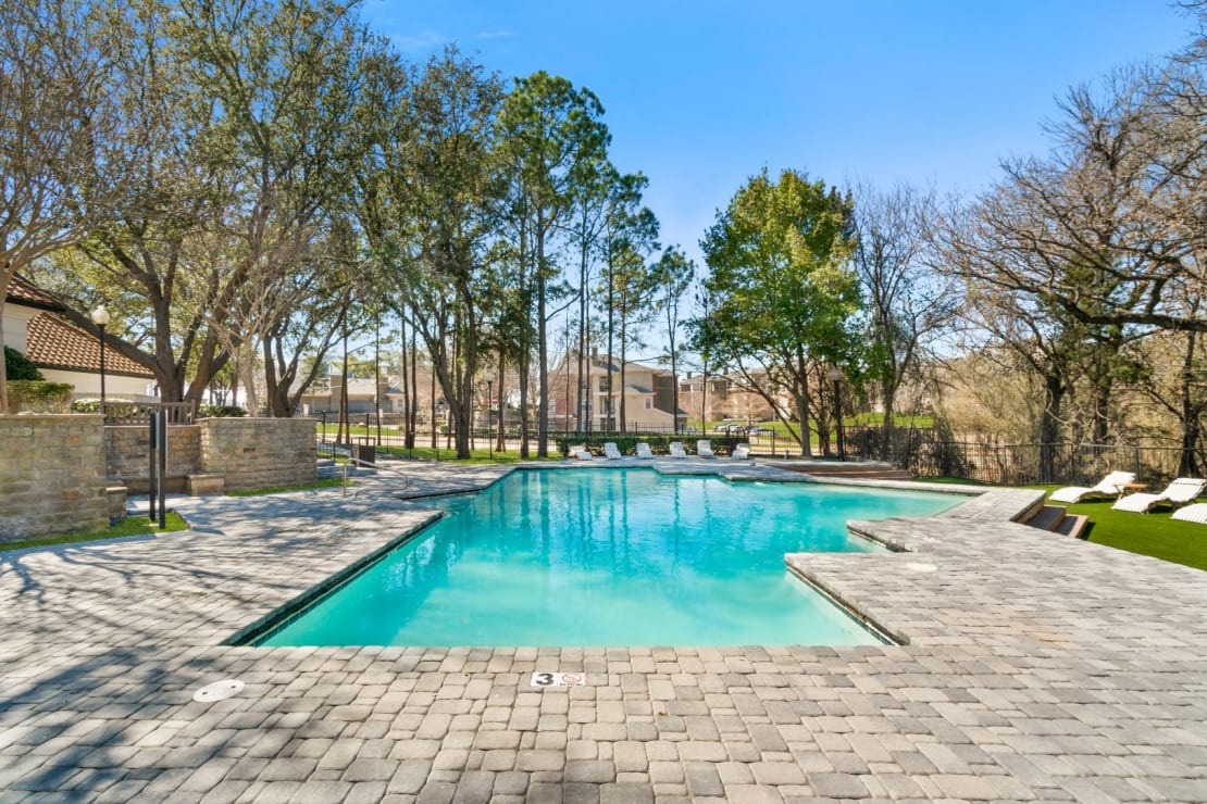 Expansive Pool Area with Poolside Sundeck