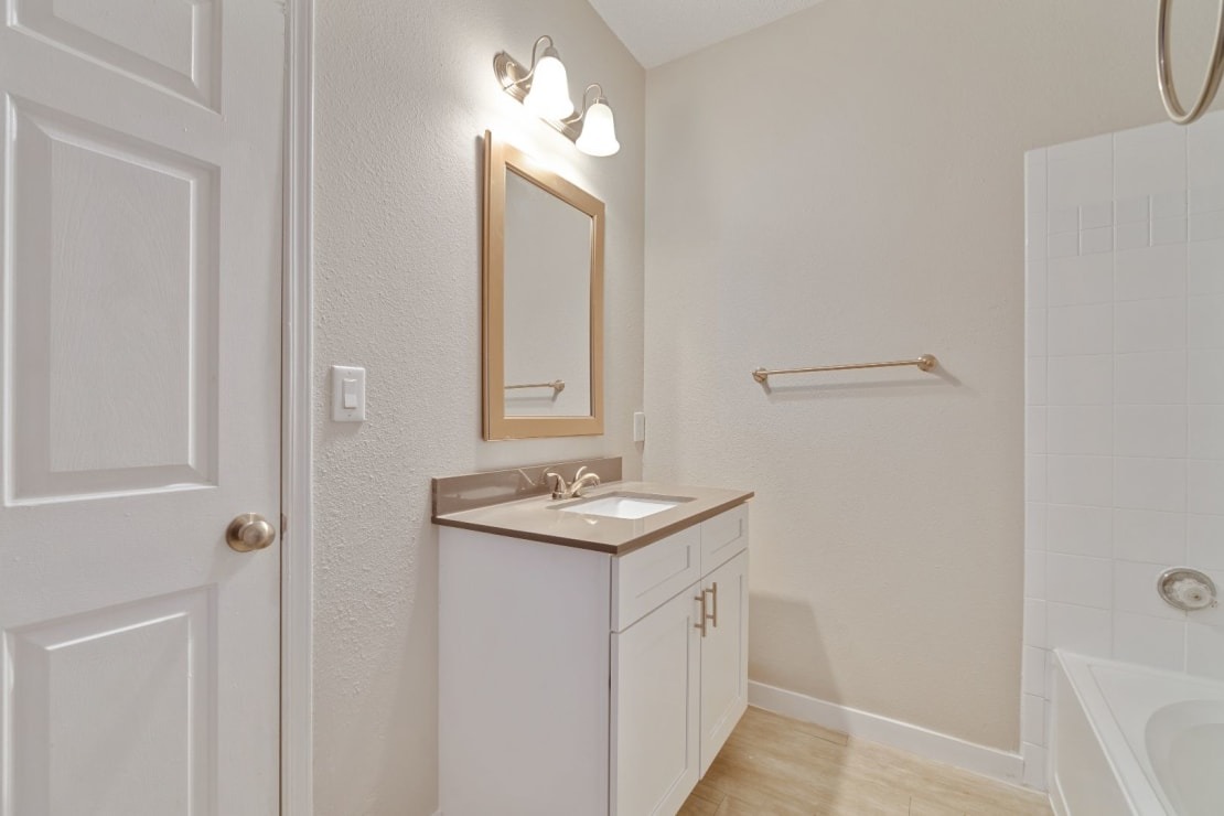 Refined Bathroom with Modern-lit Vanity Area