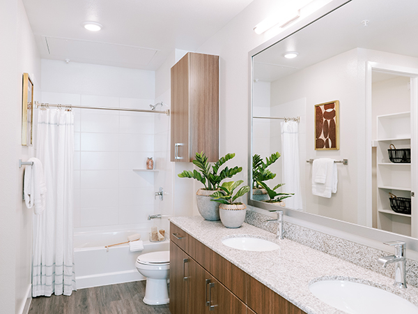 Bathroom With Double Sinks and Ample Storage Space at The Truman Arlington Commons