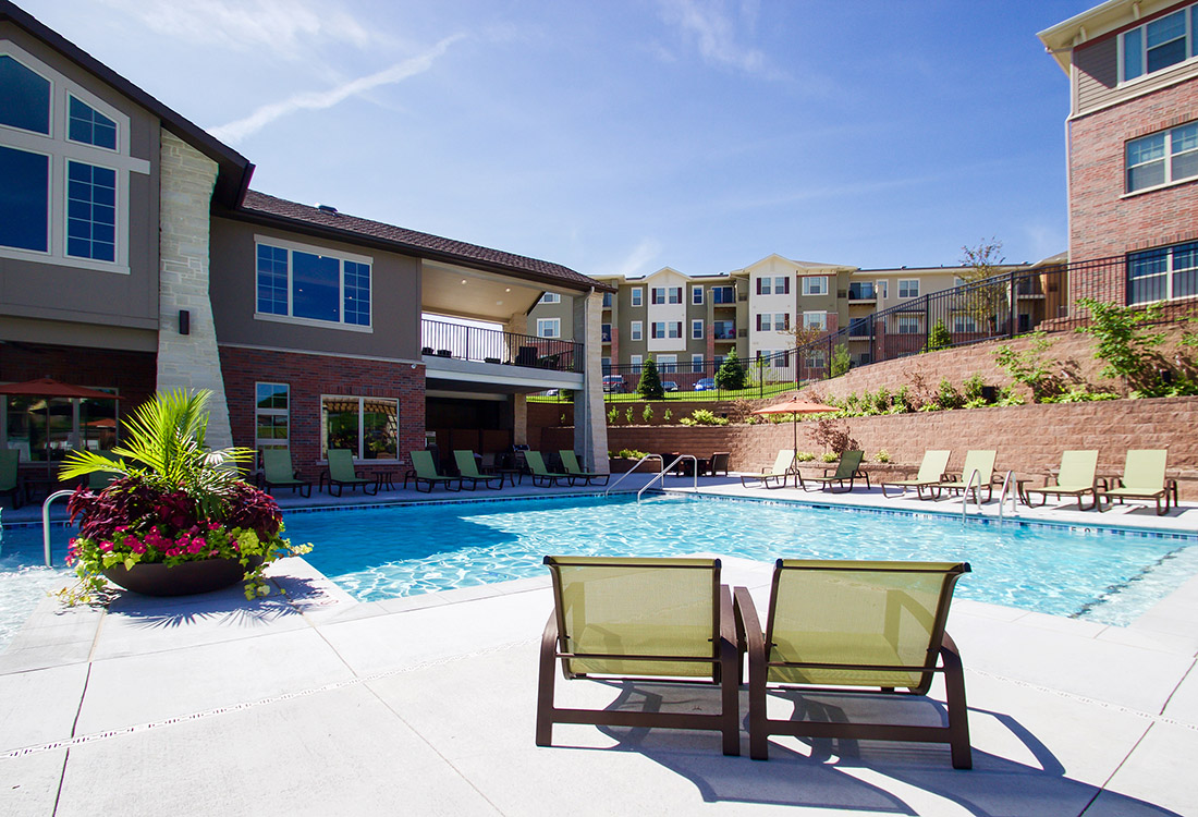 Swimming Pool with Poolside Lounge Area at Tuscany Place Apartments