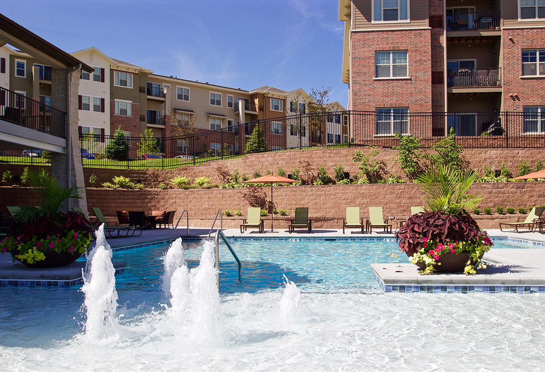 Swimming Pool with Water Feature at Tuscany Place Apartments in Papillion, NE
