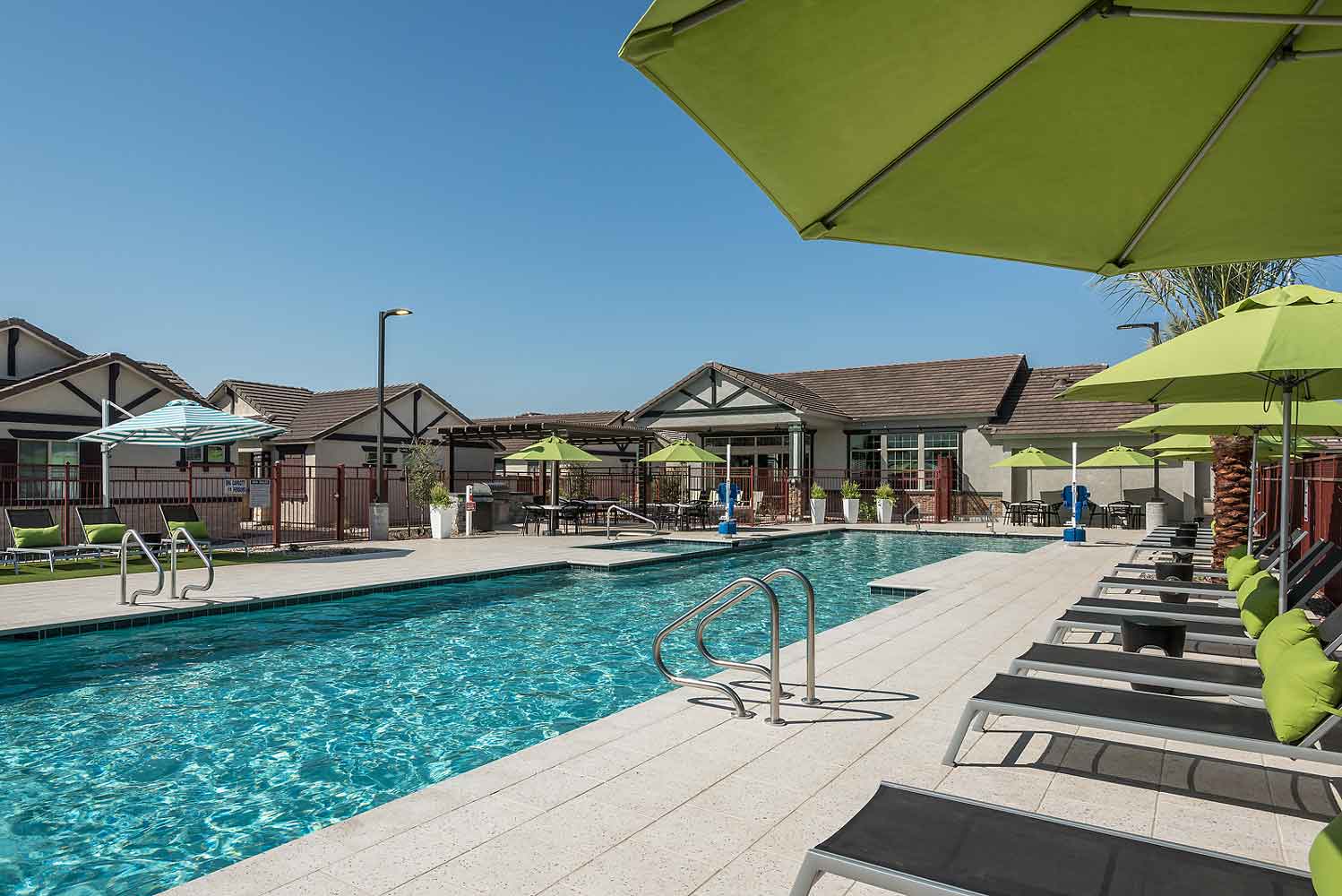 Swimming Pool with Jacuzzi and BBQ Ramada at Village at Pioneer Park Apartments
