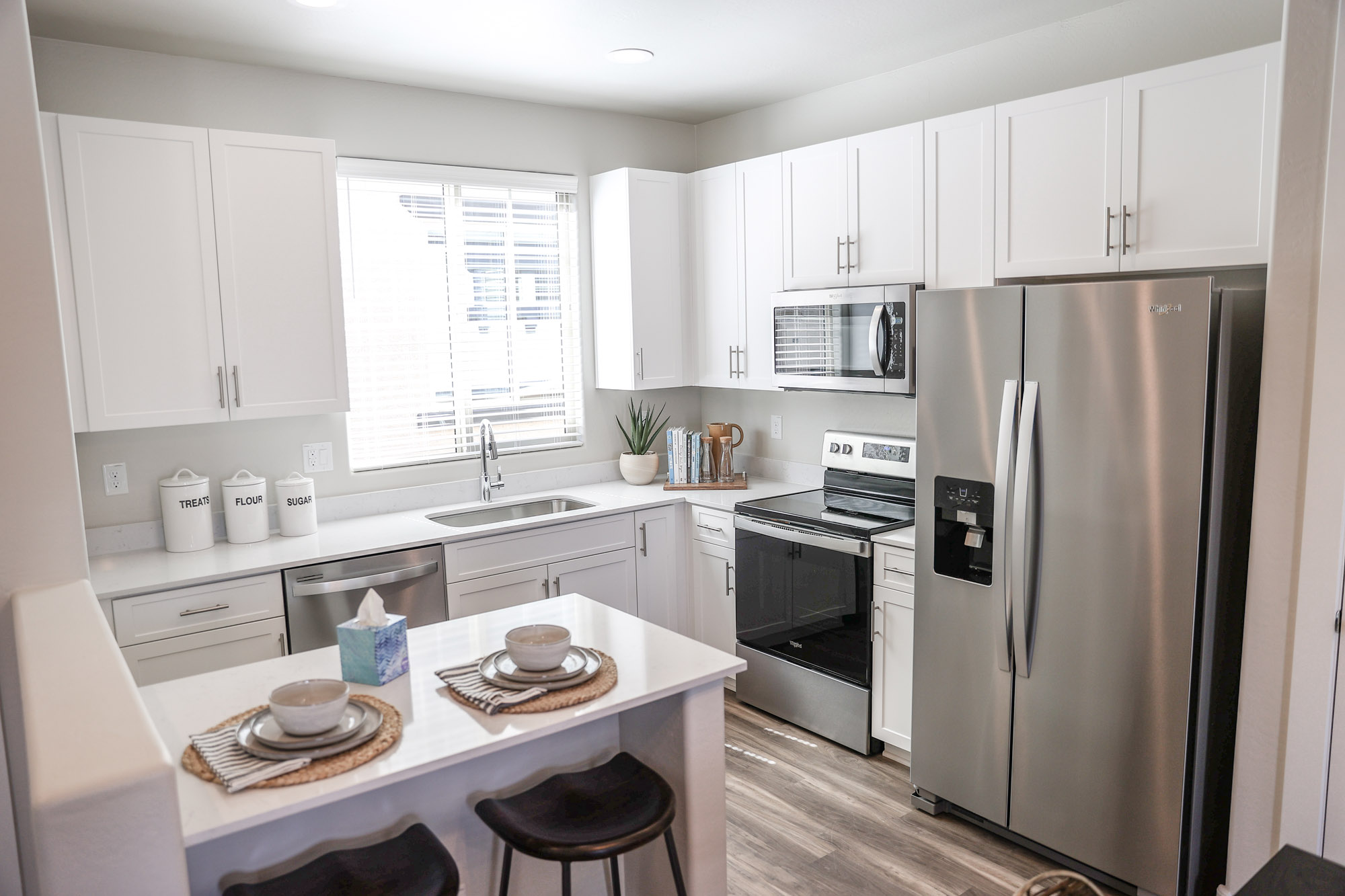 Charming White Kitchen Cabinetry at Village at Pioneer Park Apartments in Peoria, AZ