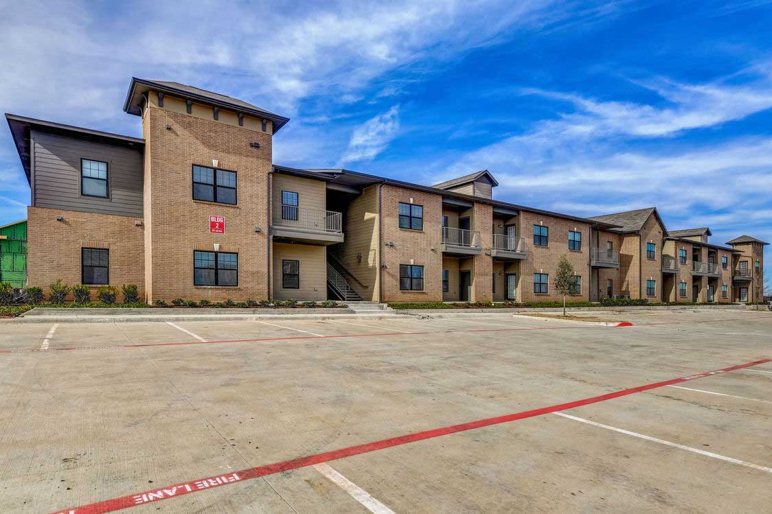 Wide Parking at The Village at The Reatta Ranch Apartment Homes in Justin, TX