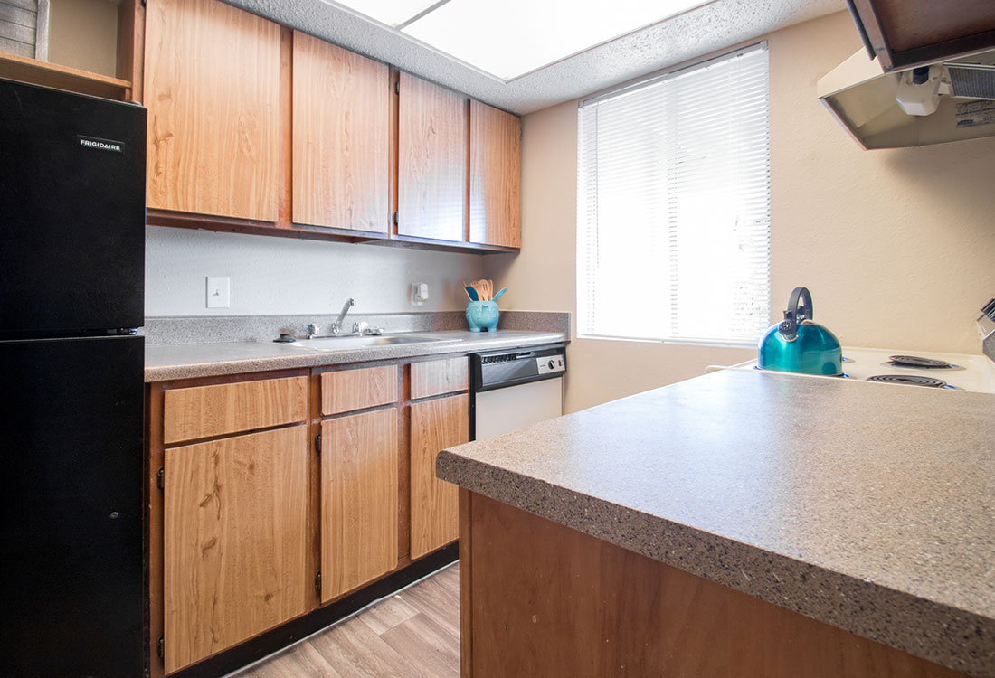 Apartments with Plank Flooring in Kitchen at Villas of Oak Creste in Northwest San Antonio, TX.
