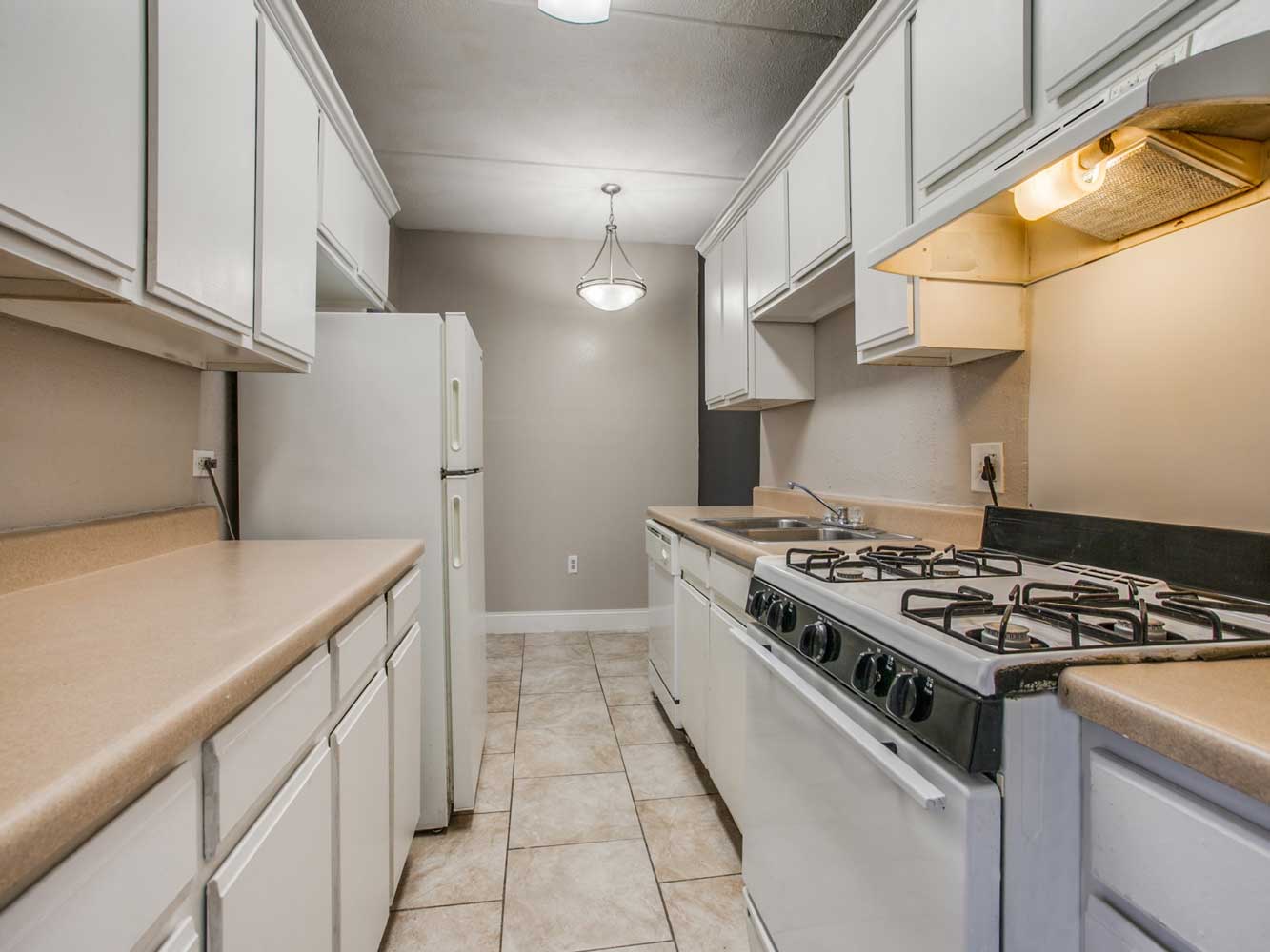 Galley-Style Kitchen at Villas on Sixty Fifth Apartments in Little Rock, Arkansas