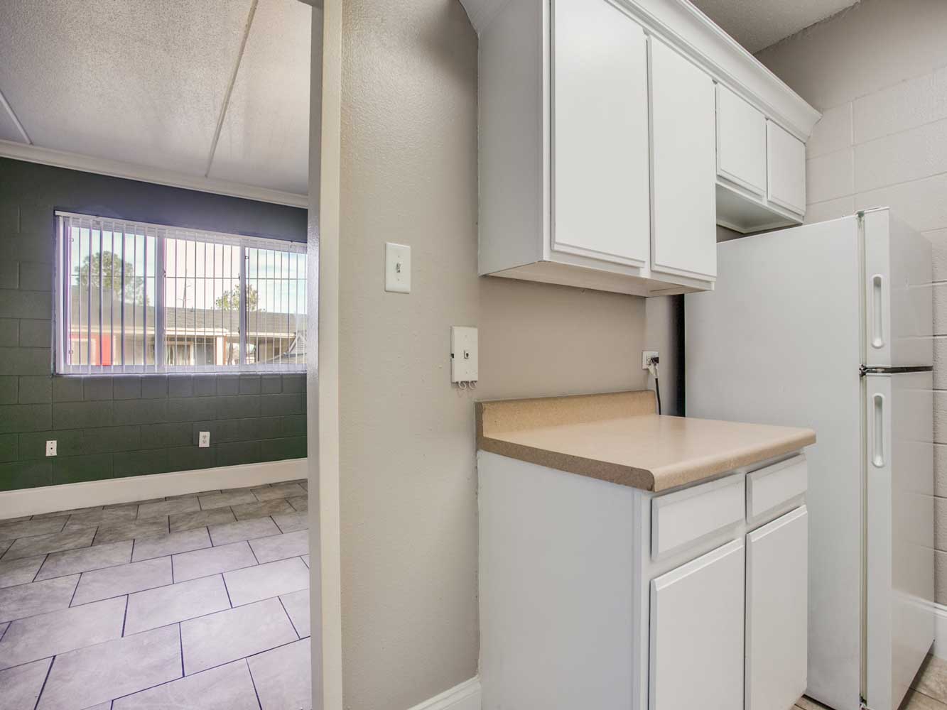 Kitchen Leading Into Living Area at Villas on Sixty Fifth Apartments in Little Rock, Arkansas