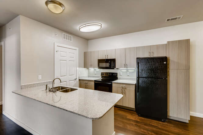 Fully Equipped Kitchen at Woodcreek Apartments In Wimberley, TX.