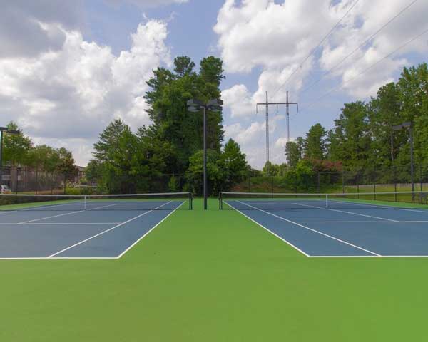Well-Maintained Tennis Courts at Woodhaven at Park Bridge Apartments